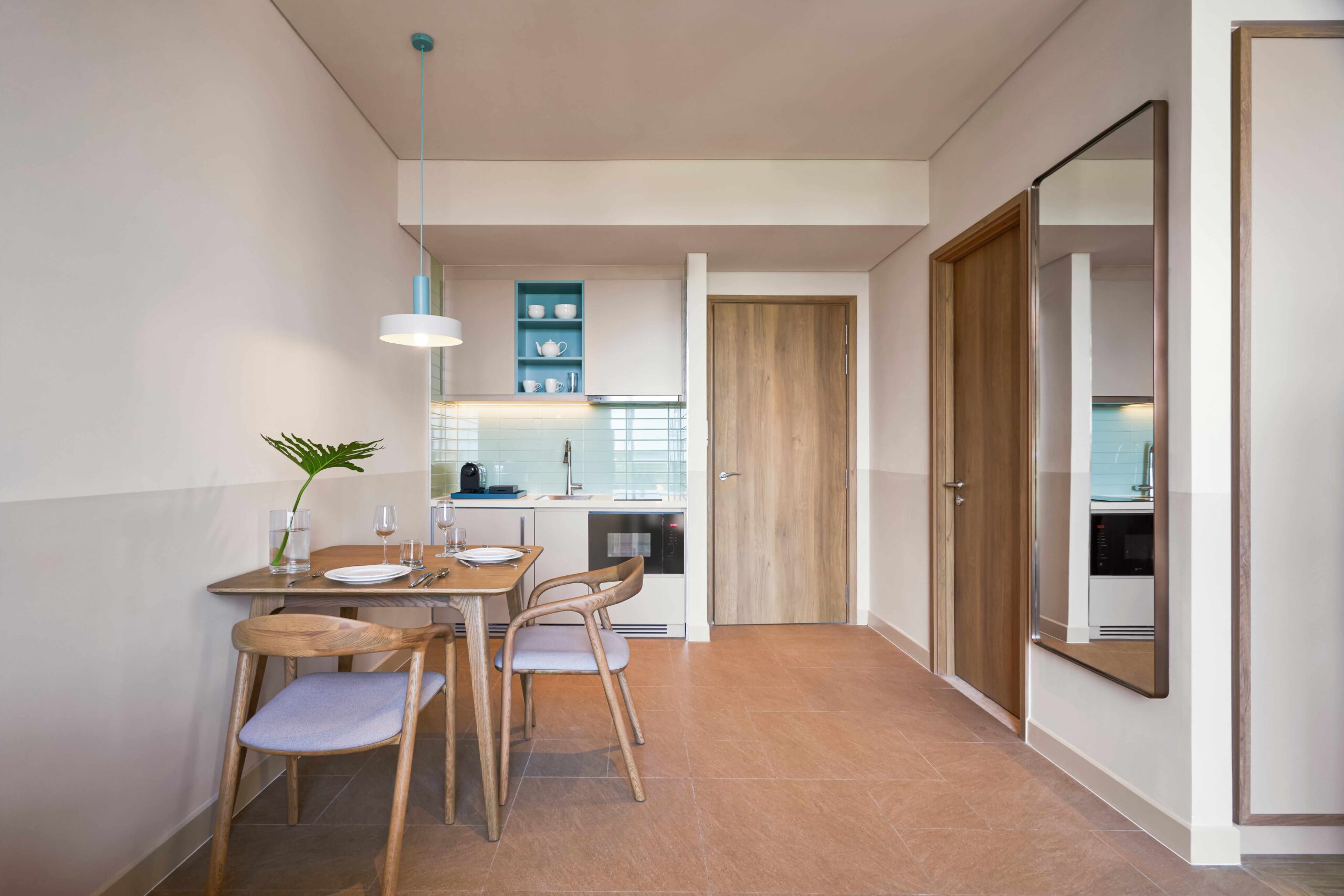 dining-entrance-area-1br-balcony-residences-43m2-ixora-ho-tram-by-fusion